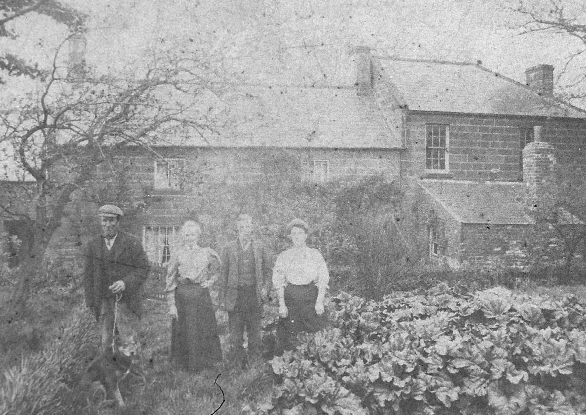 An old photo of a person

Description automatically generated